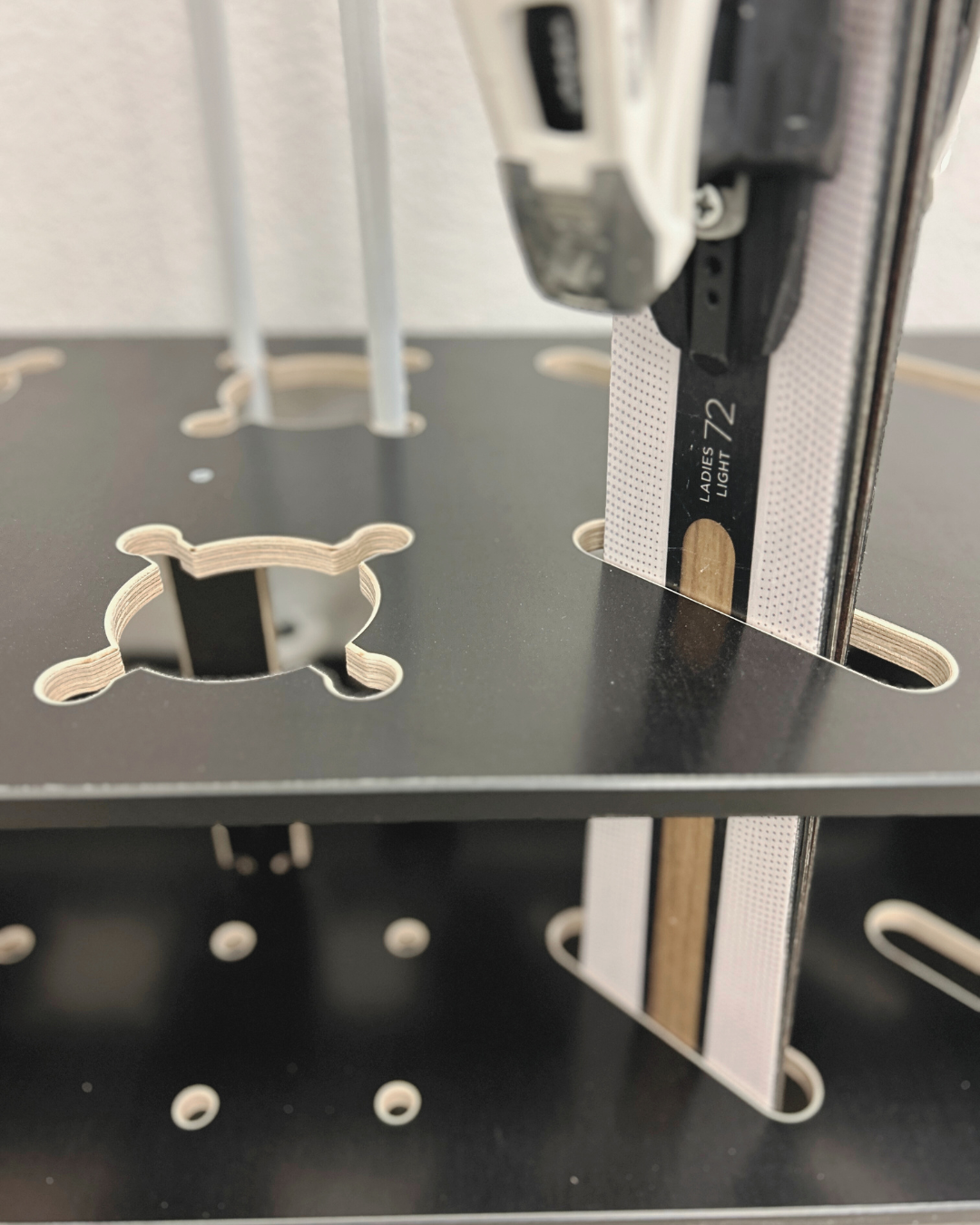 Combined wooden stand for alpine, cross‑country skis and poles